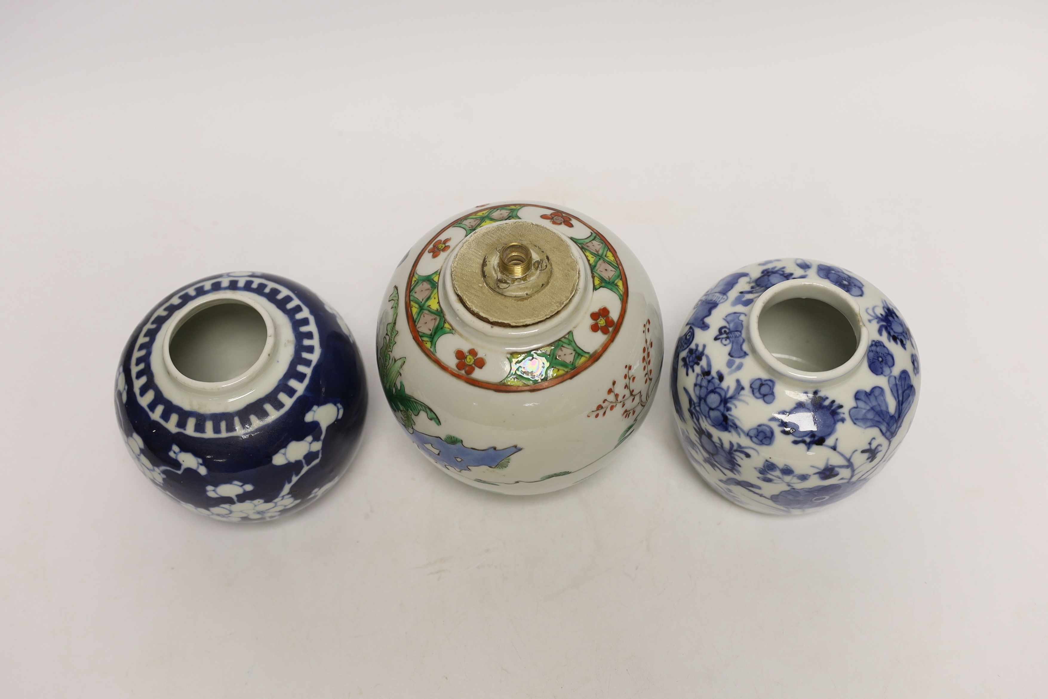 Three Chinese ginger jars, including a blue and white prunus example, Late 19th/early 20th century, largest 13cm high